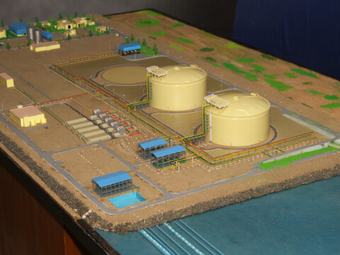 Color-coded industrial scale model showing factory equipment, piping and plant layout