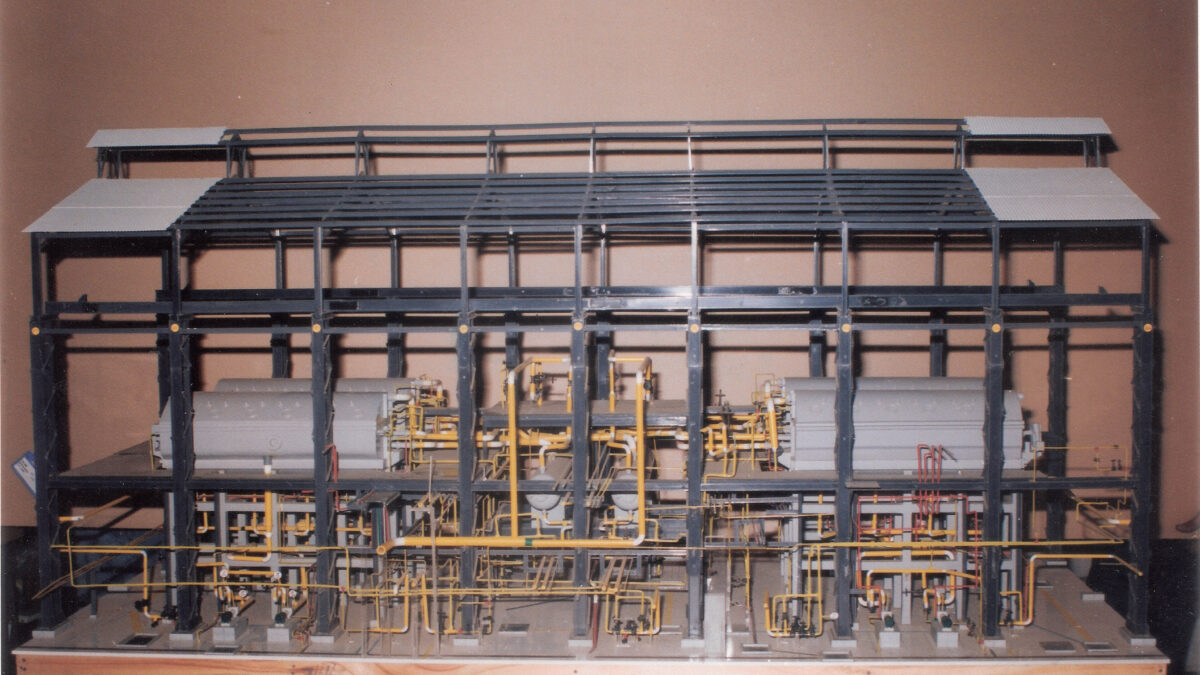 Detailed industrial scale model featuring precision piping, machinery and fabricated components